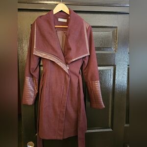 Bagatelle mid-length wine colored jacket with faux fur details. Size Large